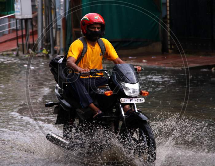 A Bike Rider On A Waterlogged Road During Rain, In Ajmer, Rajasthan, India On 04 June 2020.