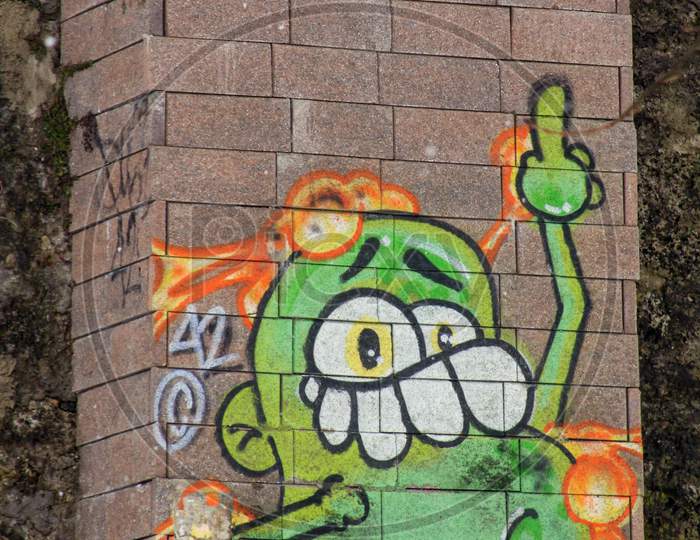 Funny Green Character Graffiti Painting On Wall