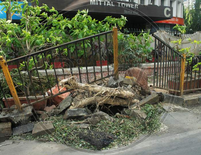 A view shows an uprooted pavement railing, after cyclone Nisarga made its landfall on June 3, on the outskirts of the city, in Mumbai, India, June 5, 2020.