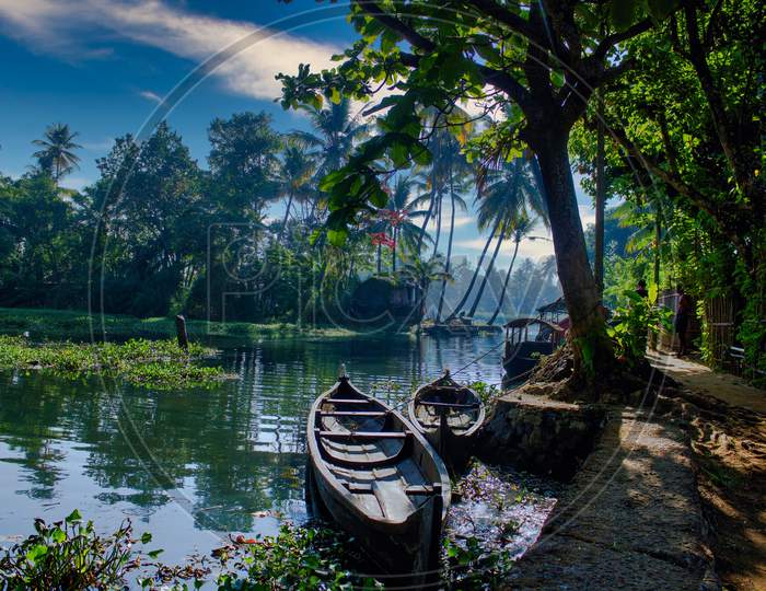 A Scenic View Of Boats In Backwaters Situated In Allepey Town Located In Kerala State