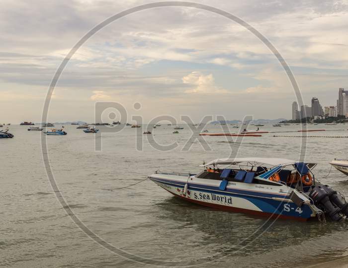 Pattaya,Thailand - April 29,2018: The Beach Tourists Relax And Swim There And Rent Boats For Trips.Some Thai People Sell Souvenirs,Food And Drinks To Them.
