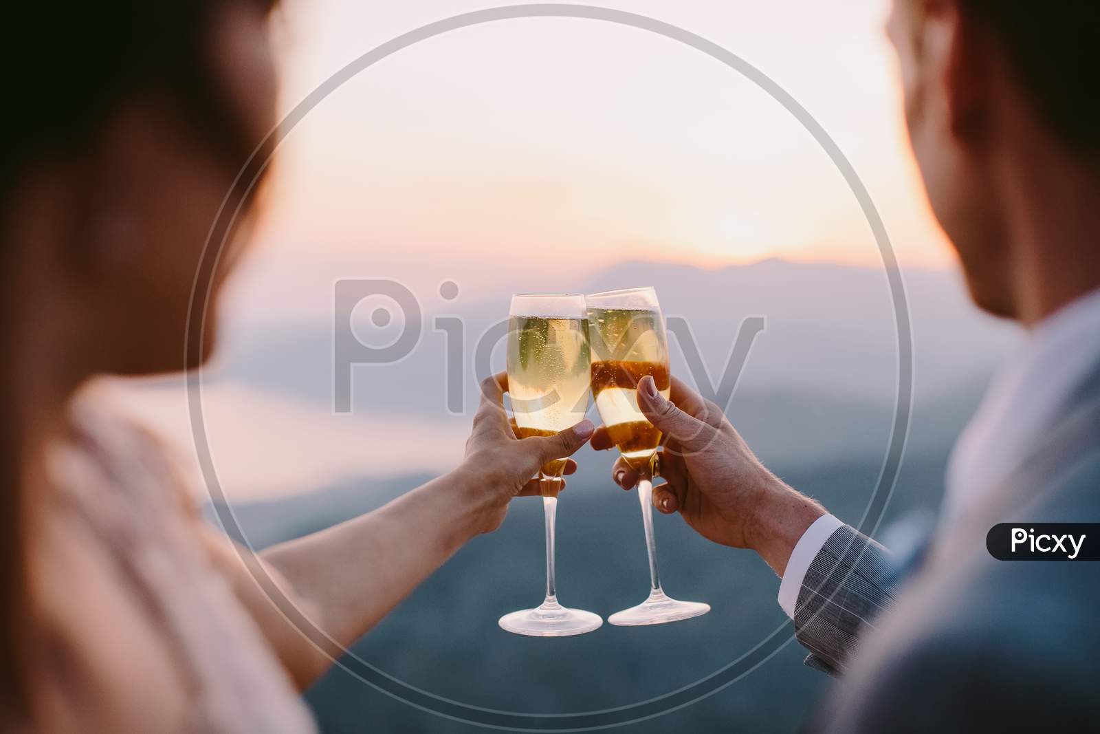 Couple Drink Champagne At Sunset