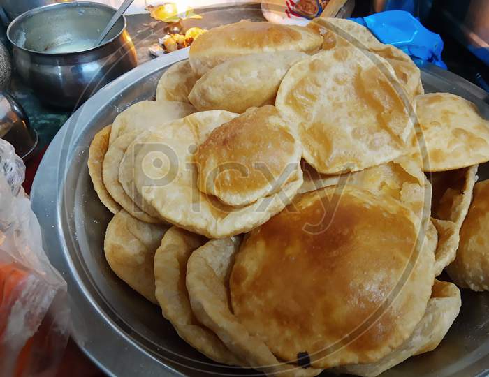 Fried Puri In A Frying Pan. Very Popular Street Food In India.Famous Indian Food, Selective Focus On Subject