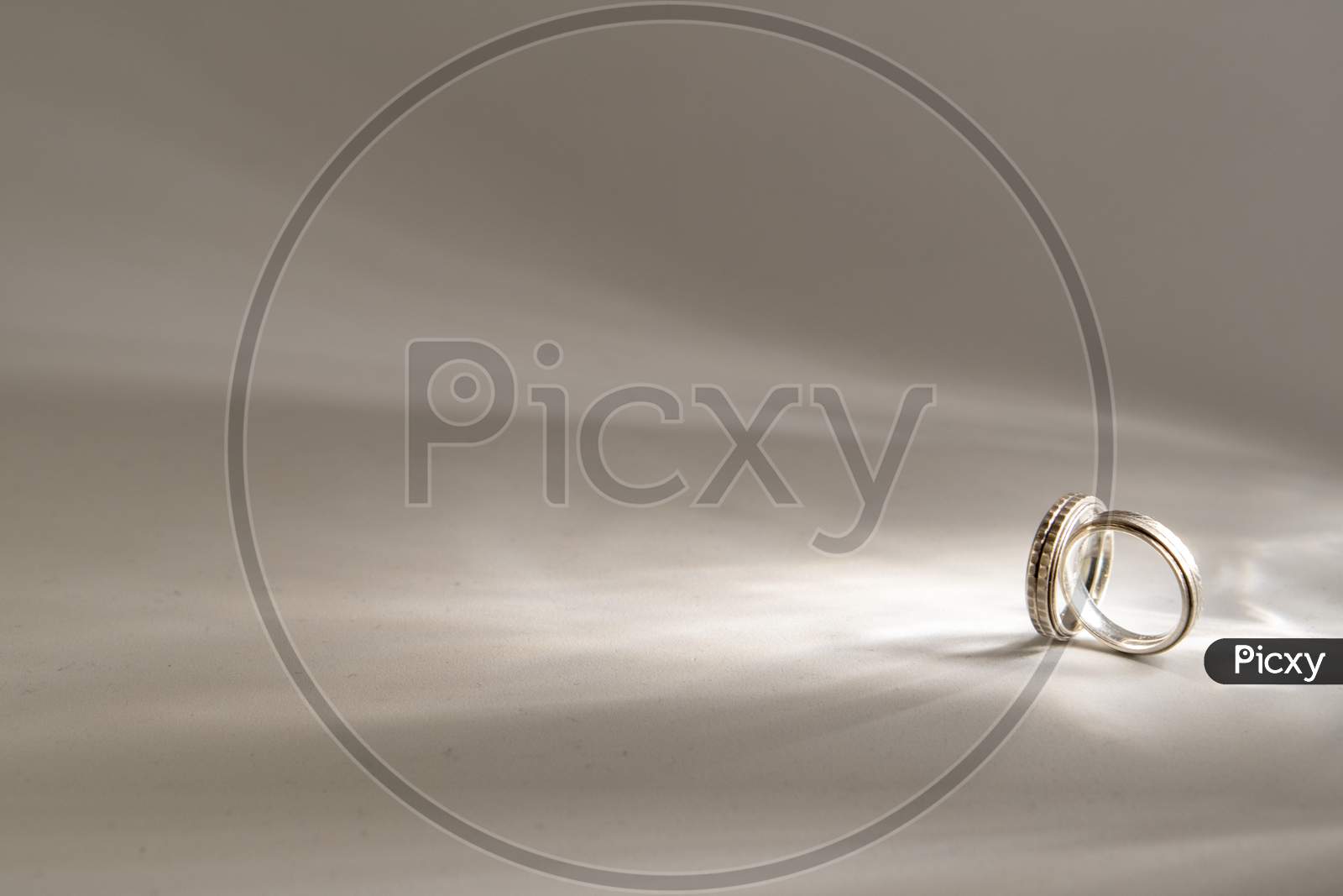 Silver Wedding rings for a groom, shot on a white background