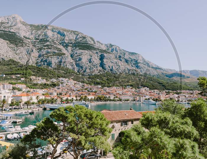 Old Town View With Mountains And Red Roofs In Croatia