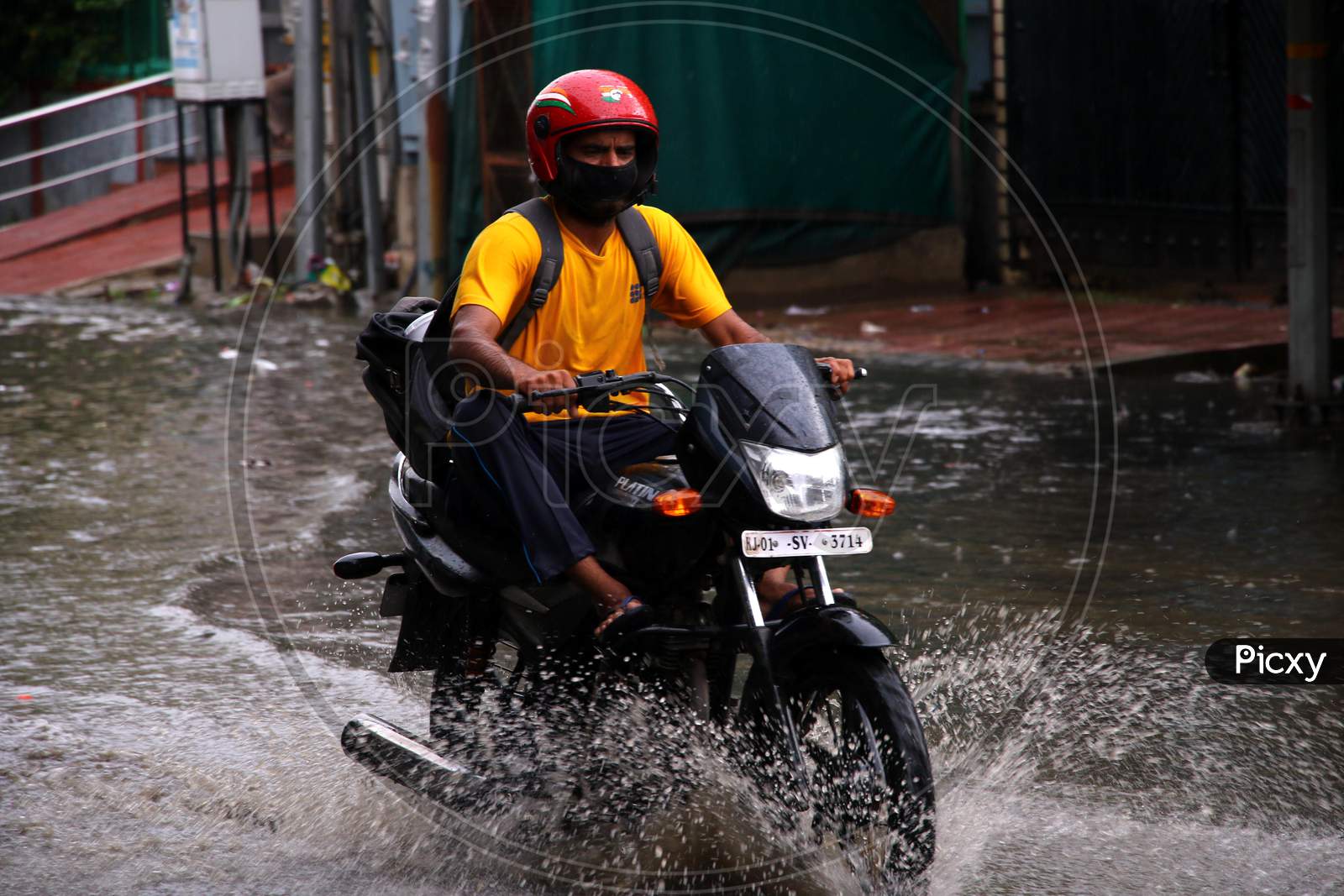 A Bike Rider On A Waterlogged Road During Rain, In Ajmer, Rajasthan, India On 04 June 2020.