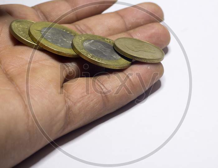 Coins In Hands. Saving Money Concept
