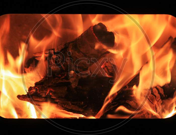 Burning Wood To Make Fire In Fireplace.