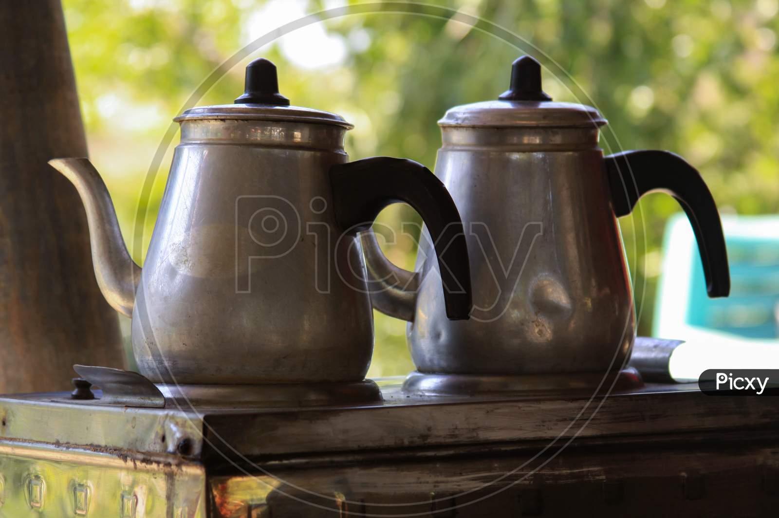Two Traditional Turkish Tea Metal Pots On A Stove