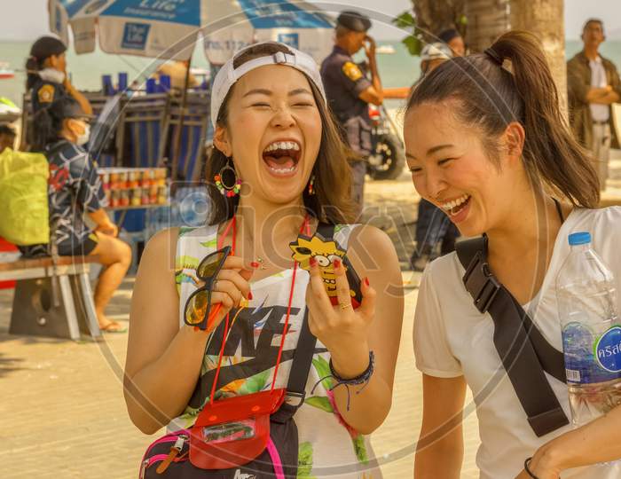 Pattaya,Thailand - April 19,2019:Beachroad Two Young Thai Girls Had Fun While Celebrating The Last Day Of Songkran.
