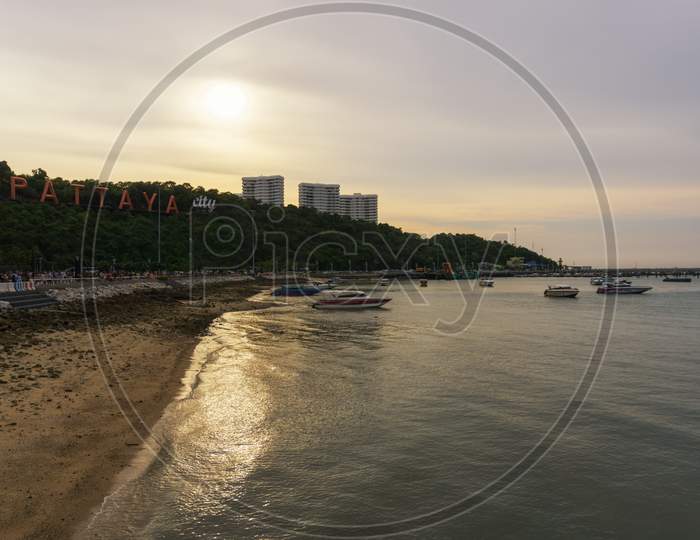 Pattaya,Thailand - April 14,2019:Bali Hai This Is The Colorful View On An Early Evening From The Harbour To The Buddha Hill With Three Big Apartment Buildings.