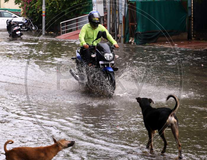 A man Rides On A Waterlogged Road During Rain, In Ajmer, Rajasthan, India On 04 June 2020.