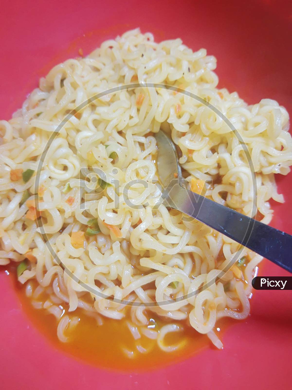 Famous Home Made Asian Instant Noodle In A Porcelain Bowl With Fork And Spoon Close Up.