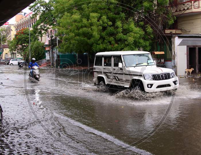 Commuters drive through A Waterlogged Road During Rain, In Ajmer, Rajasthan, India On 04 June 2020.