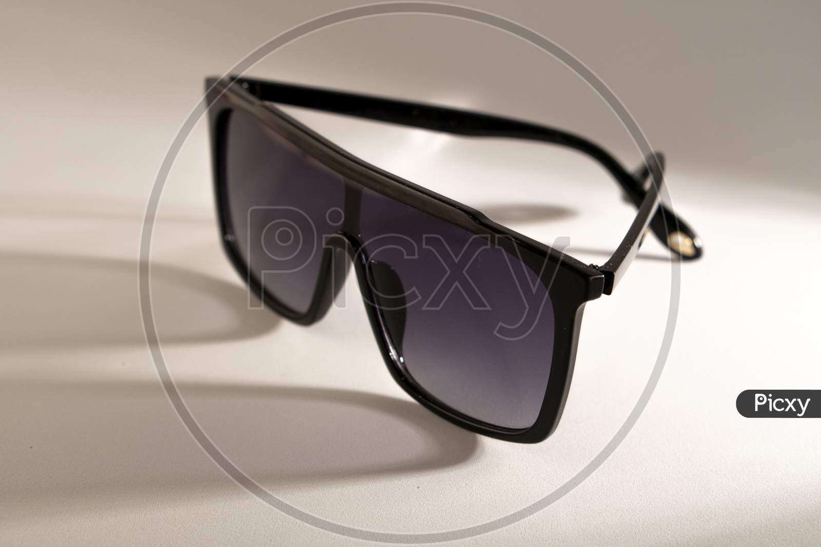 Oversized shaded sunglass on a white background