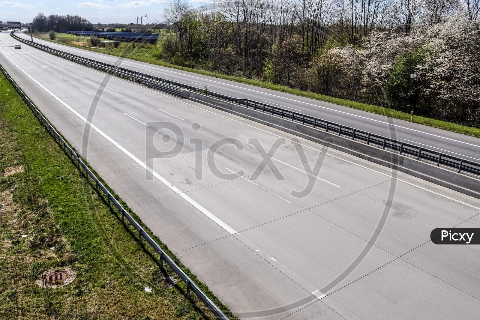 erspective view on an empty european highway on a sunny day during corona