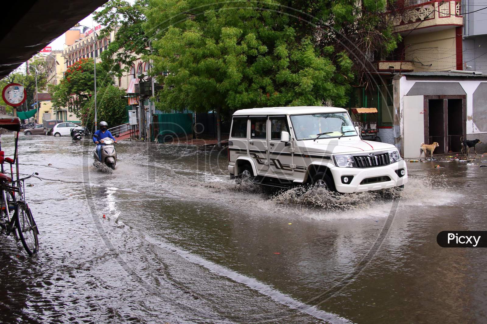 Commuters drive through A Waterlogged Road During Rain, In Ajmer, Rajasthan, India On 04 June 2020.