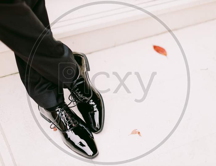 Groom Wearing Black Patent Shoes Outdoors Closeup