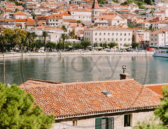 Old Town View With Mountains And Red Roofs In Croatia