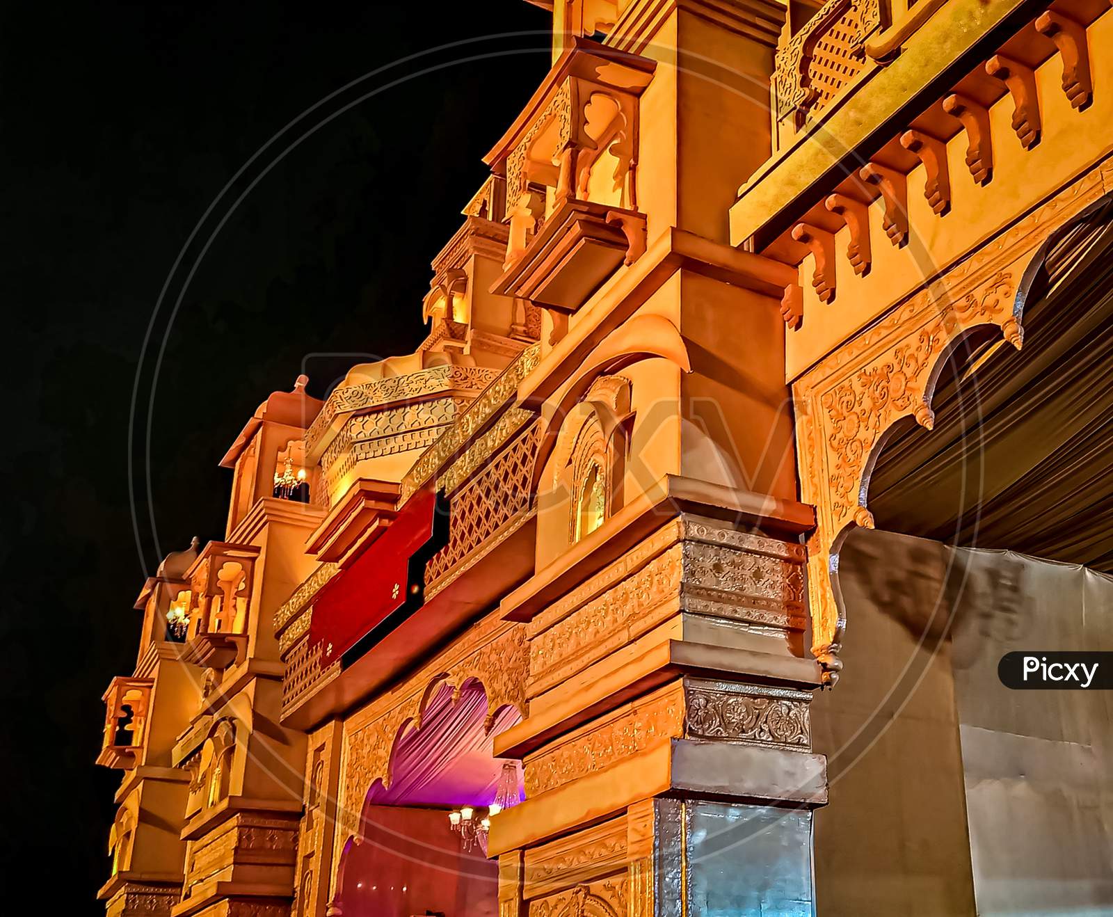 Gallery window of golden palace in moonlight at dark night