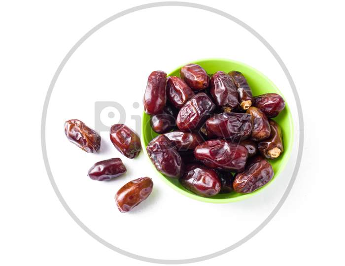 khajur, raisin/kismis, kaju badam/ cashew and almonds all at a single frame stock image white background.