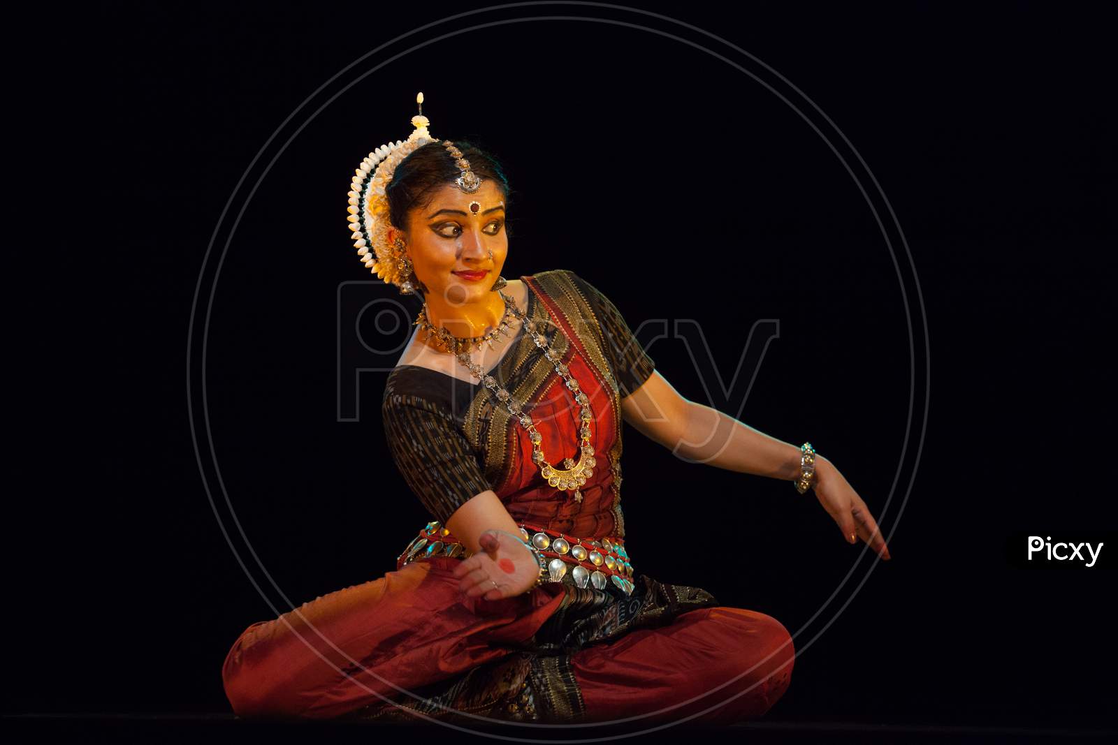 A highly talented junior Odissi dancer looks at the lord adoringly during the Odissi evening recital event on October 19,2018 at Bharatiya Vidhya Bhavan in Bengaluru,India