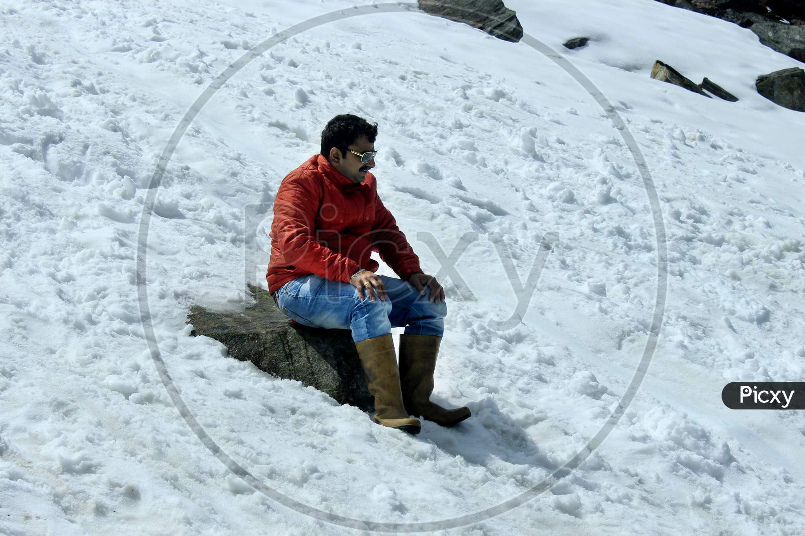 A Man on a Snow Capped Mountain in Sikkim