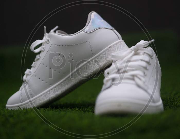 white shoes on the grass
