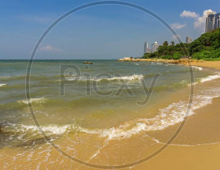 Pattaya,Thailand - April 20,2018: Coral Beach This Is A Small Beach With Some Rocks And Stones And With A View To Wongamat Beach.