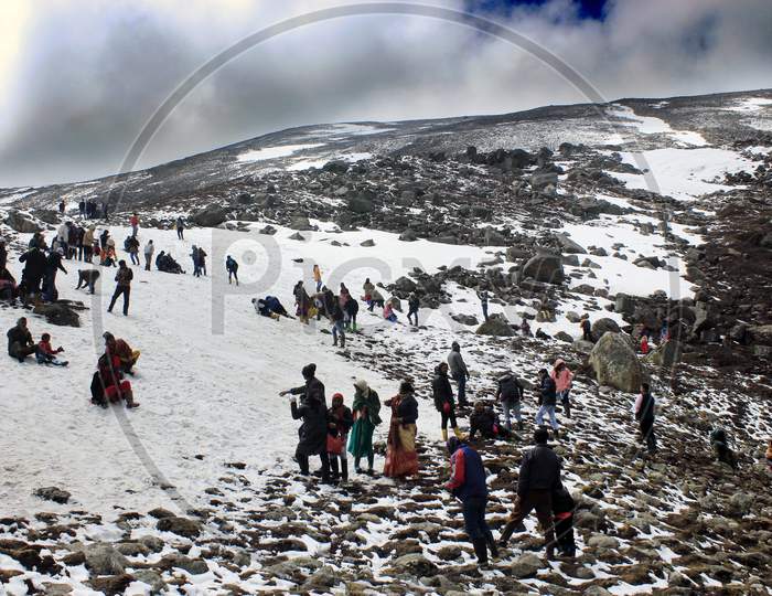 People on Snow Capped Mountain