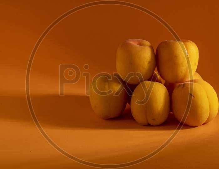 Peach on a orange background.