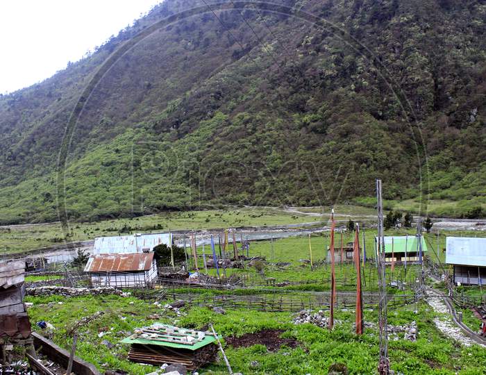 Mountains of Sikkim with A House in the foreground
