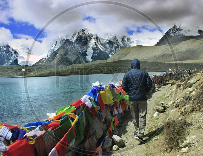 Tibetan prayer flags with Snow Capped Mountains on the Background