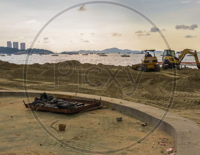 Pattaya,Thailand - October 16,2018: The Beach Thai Workers Enlarged The Beach Through Filling It Up With New Sand.