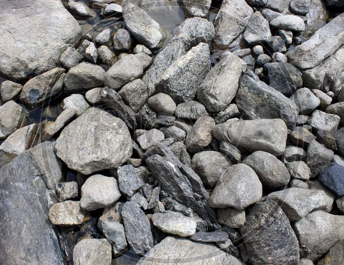Close up shot of Stones in A Lake