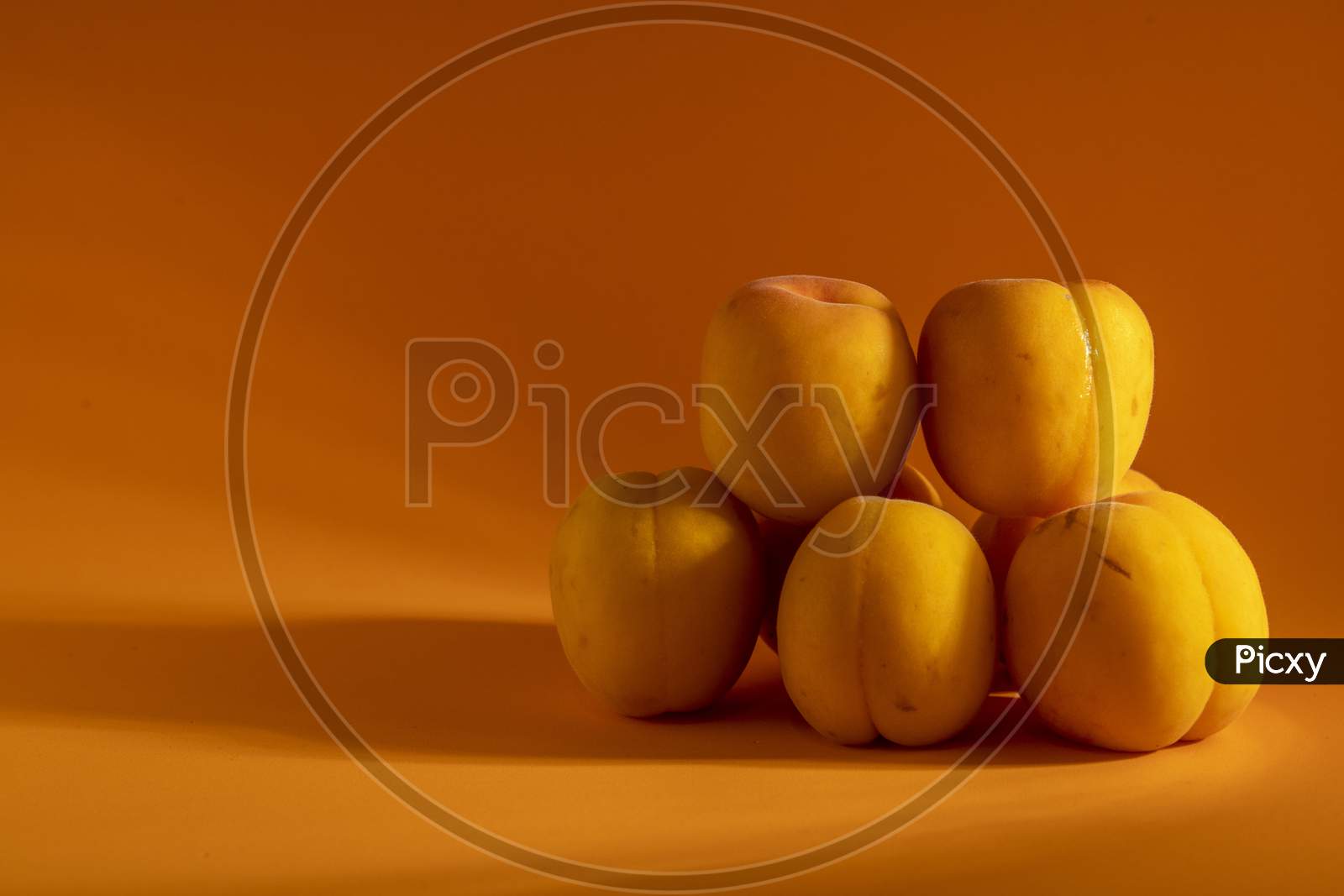 Peach on a orange background.