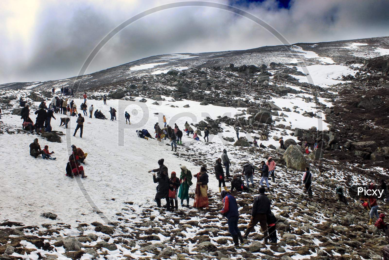 People on Snow Capped Mountain