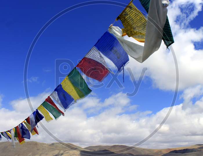 Tibetan prayer flags with Mountains on the Background