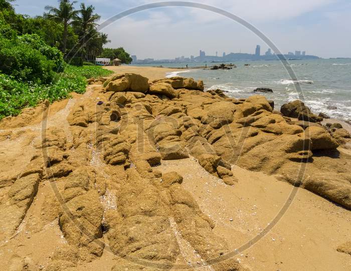 The Rocky And Public Coral Beach With A View To Pattaya
