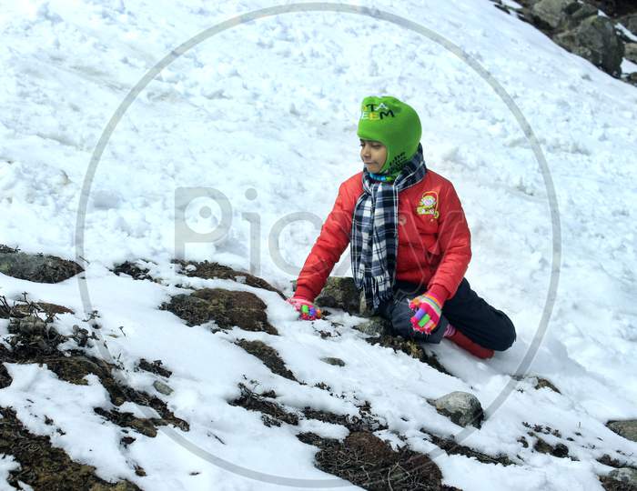 A Kid on a Snow Capped Mountain in Sikkim
