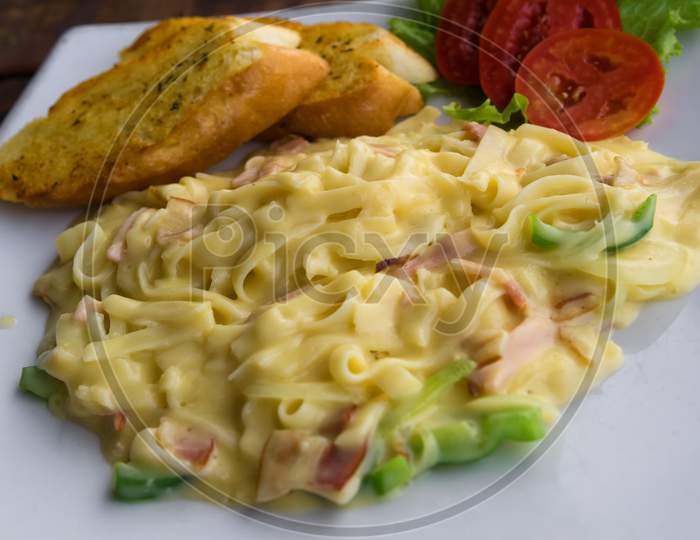 Delicious Pasta With Sauce,Ham And Tomatoes