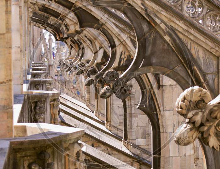 Under Flying Buttresses Of Duomo Di Milano