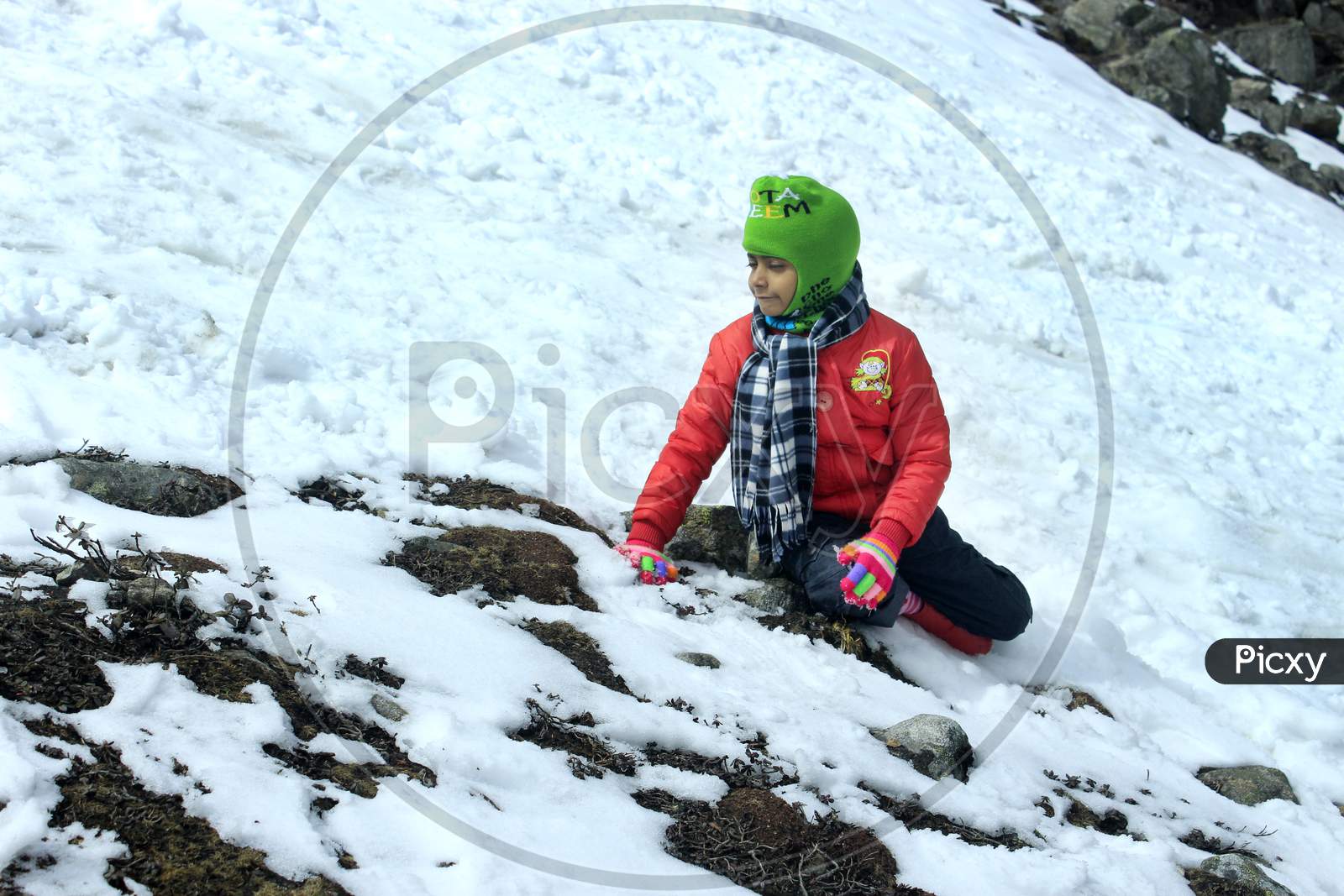 A Kid on a Snow Capped Mountain in Sikkim