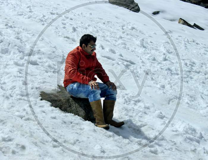 A Man on a Snow Capped Mountain in Sikkim