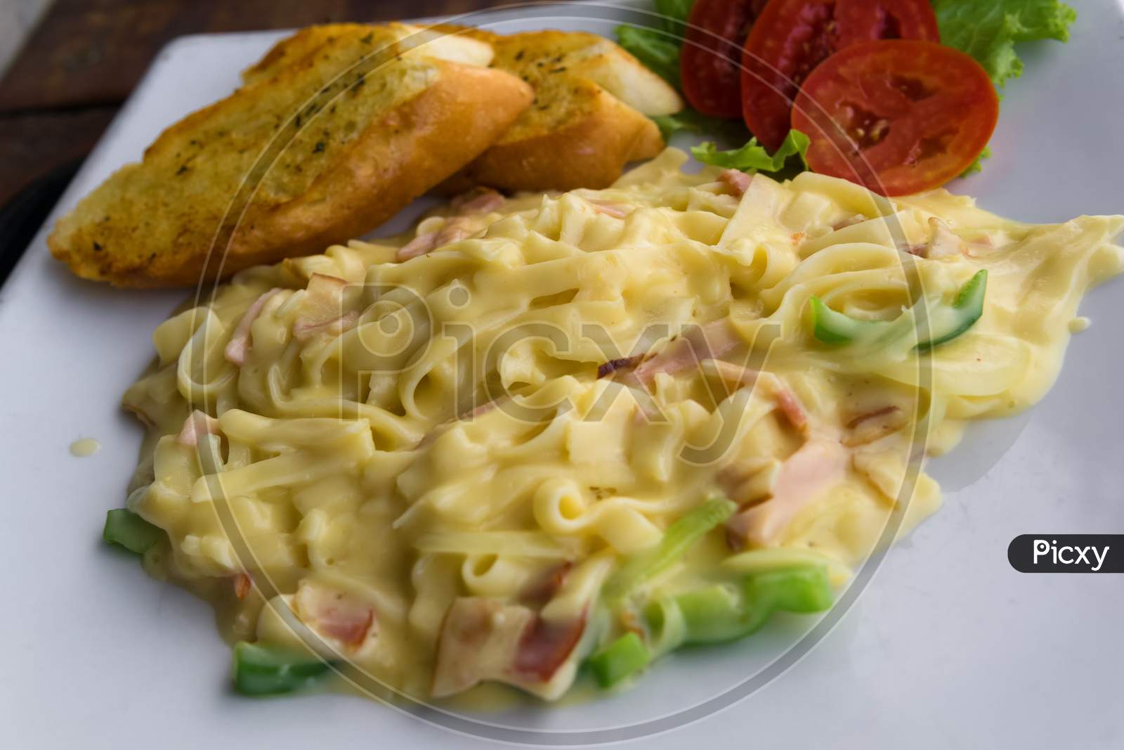 Delicious Pasta With Sauce,Ham And Tomatoes