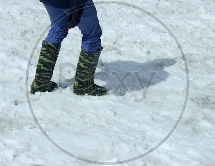 Selective Focus on A Person's legs on the Snow