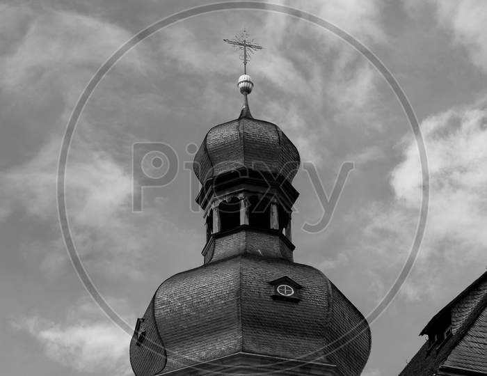 An Old Church Tower In Monochrome