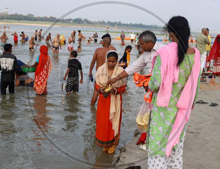 Hindu Devotees Offering Prayers After Takes Holy Dip In The Sangam, Confluence Of Three Rivers, The Ganga, The Yamuna And Mythical Saraswati After Lunar Eclipse Or Chandra Grahan In Prayagraj, June 6, 2020.