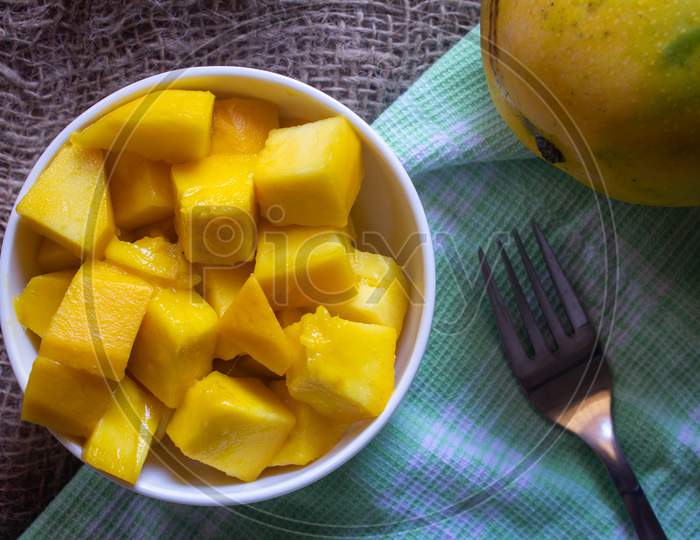 Imam Pasad Mango(Considered King Of Mangoes) Cut Into Cube Shape. Tasty Himam Pasand Mangoes Sliced.