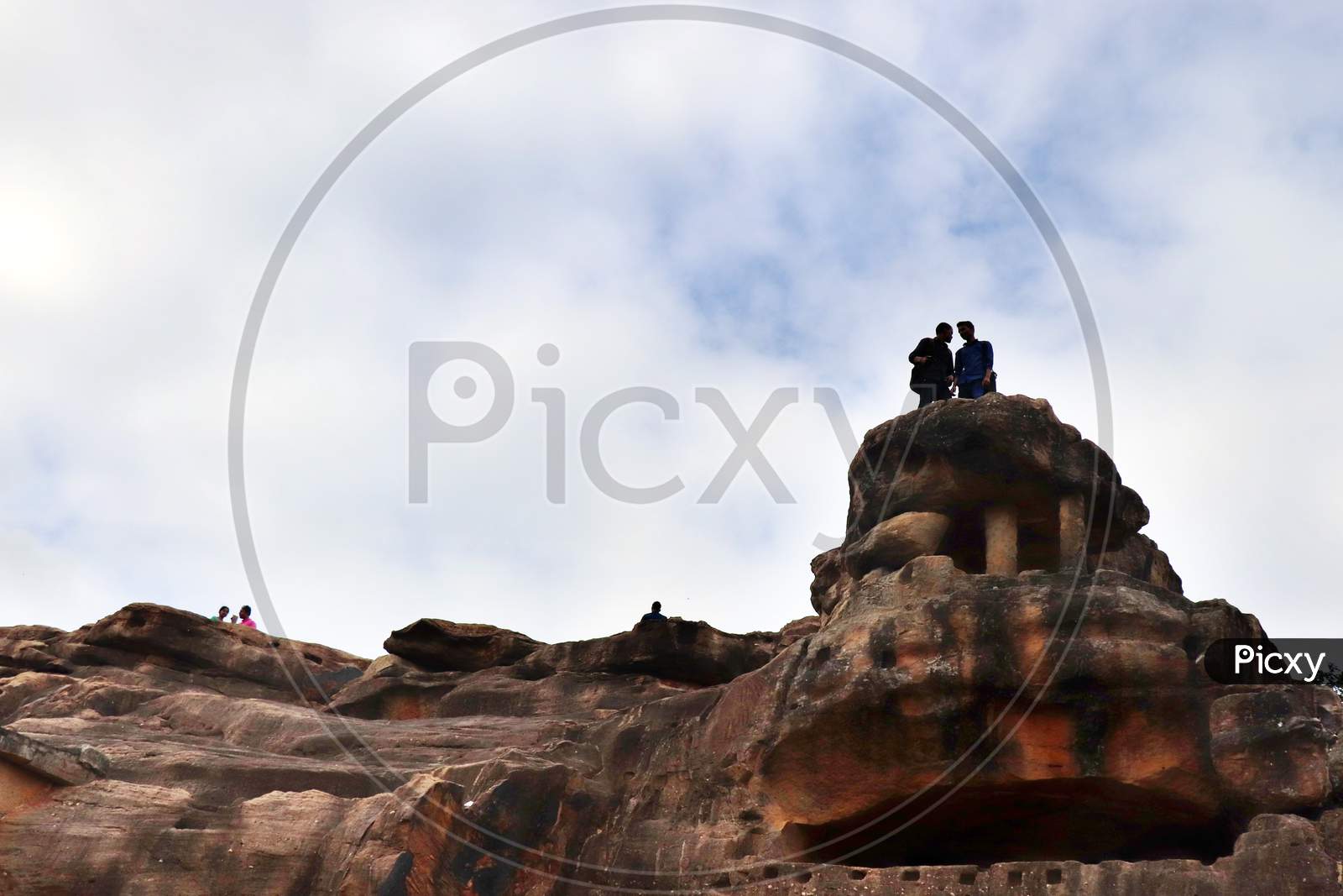 People on the edge of a mountain Cliff